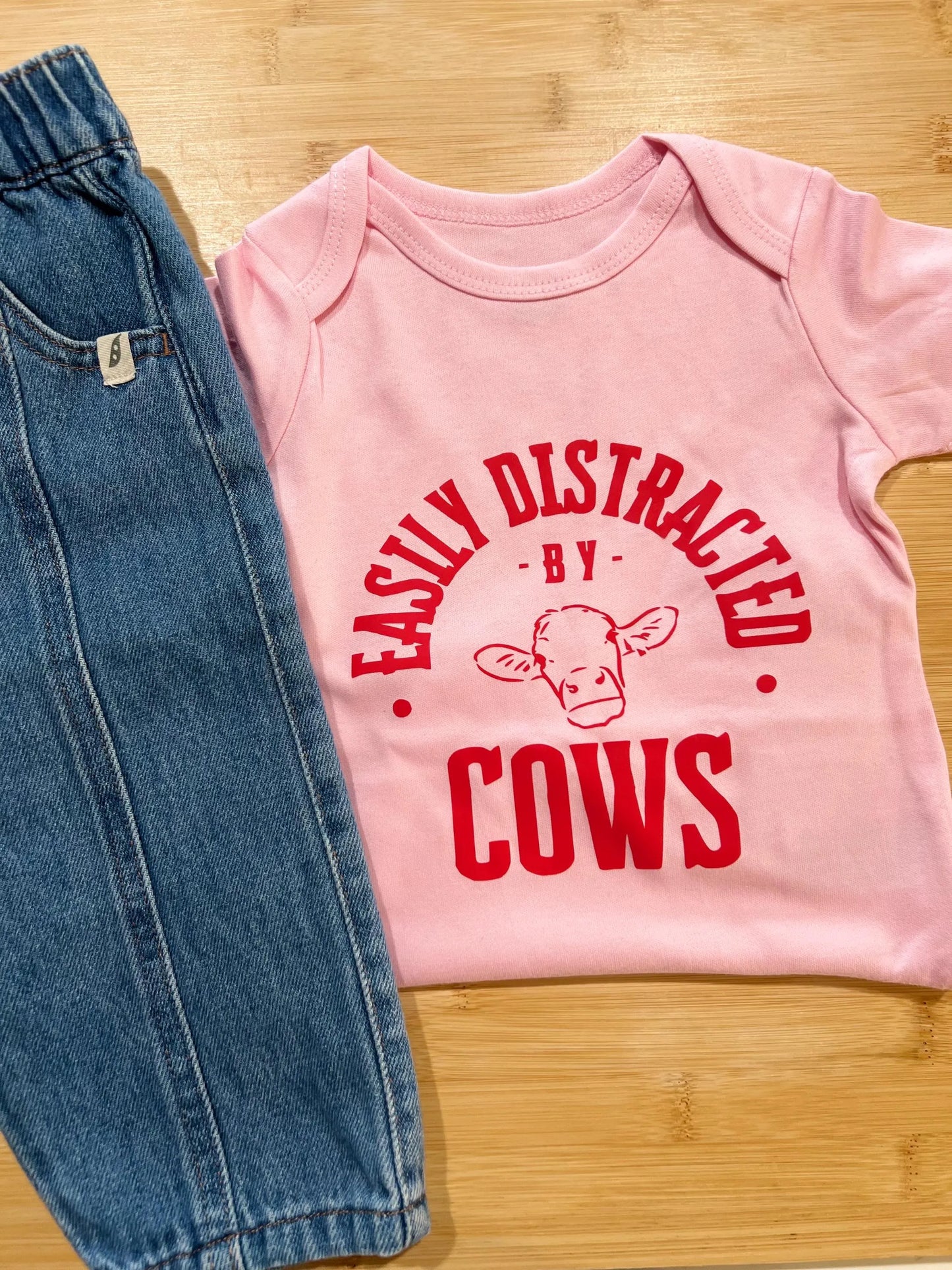 Easily Distracted by Cows Baby Onesie